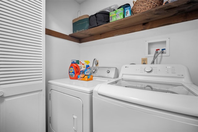 clothes washing area with laundry area and washing machine and clothes dryer