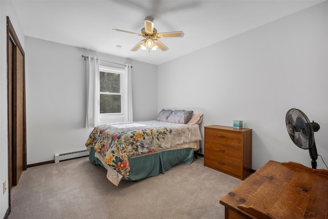 bedroom with ceiling fan, a closet, carpet floors, and a baseboard radiator