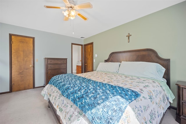 bedroom featuring visible vents, baseboards, light colored carpet, and ceiling fan