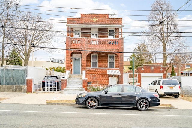 townhome / multi-family property with brick siding