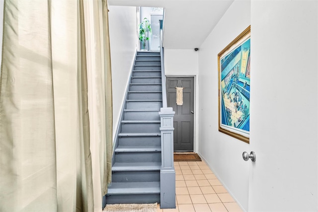 staircase with tile patterned flooring