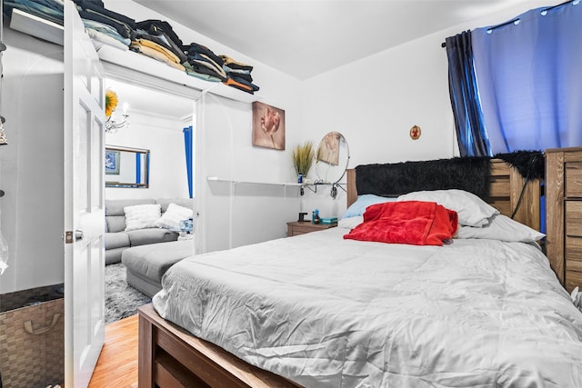 bedroom with wood finished floors