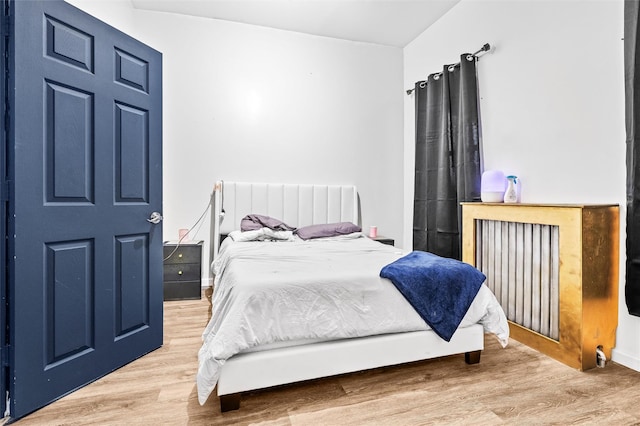 bedroom featuring wood finished floors