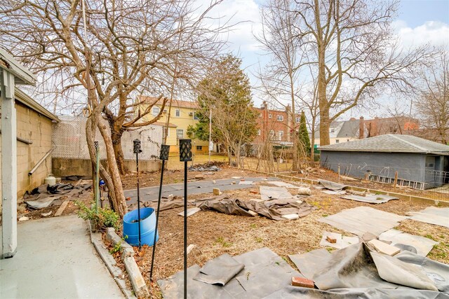 view of yard featuring a residential view and fence