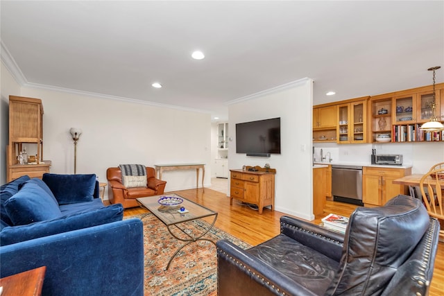 living room with a toaster, recessed lighting, ornamental molding, light wood-type flooring, and wet bar