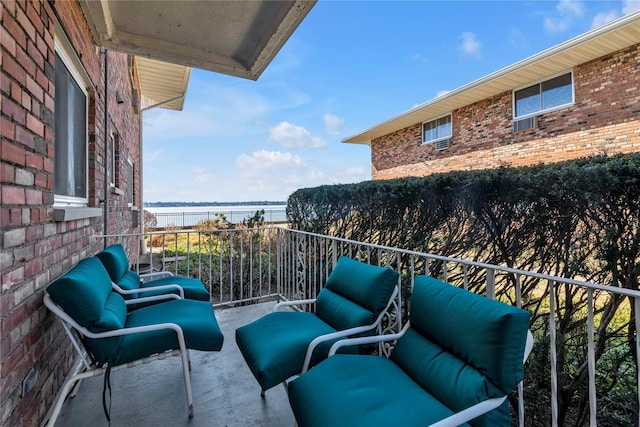 balcony featuring a water view