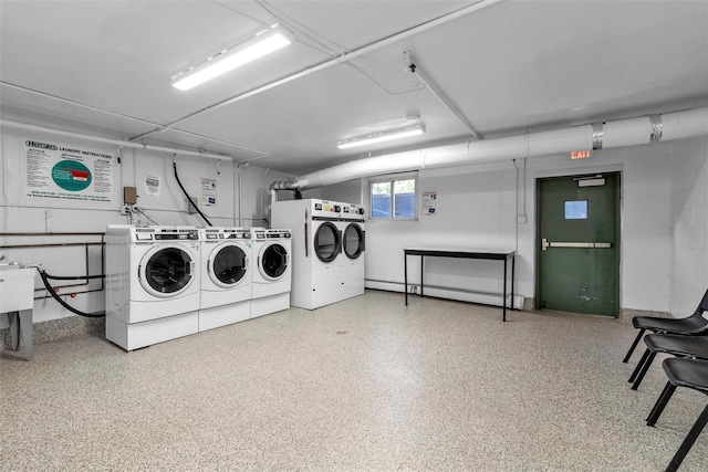 shared laundry area featuring washing machine and dryer