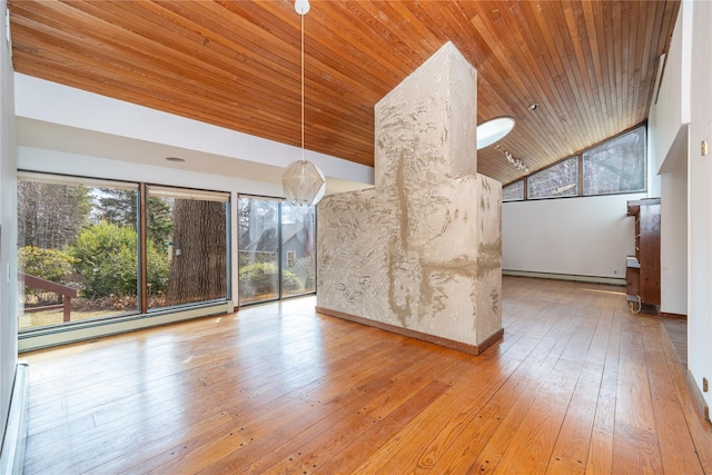 unfurnished living room featuring baseboard heating, a baseboard radiator, wooden ceiling, and hardwood / wood-style flooring