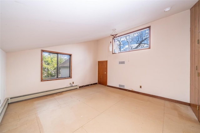 empty room with baseboards, visible vents, lofted ceiling, plenty of natural light, and a baseboard heating unit