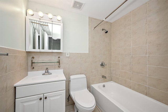 41-38 66th St, Woodside, NY 11377 - bathroom featuring tile walls, bathtub / shower combination, visible vents, toilet, and vanity