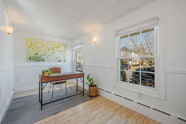 home office featuring baseboards, crown molding, and baseboard heating