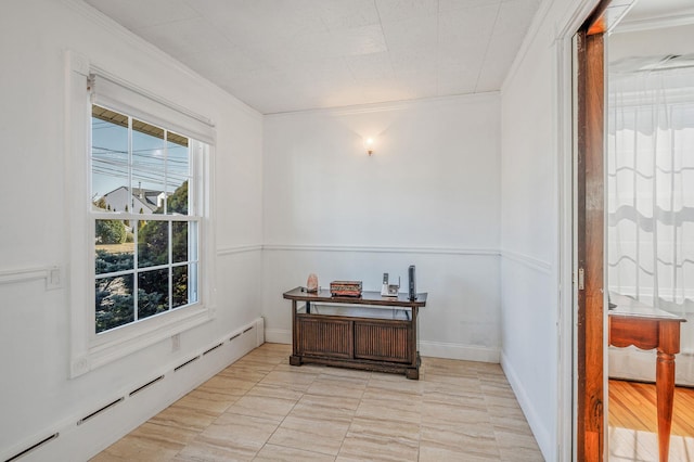 home office featuring ornamental molding, baseboard heating, and baseboards