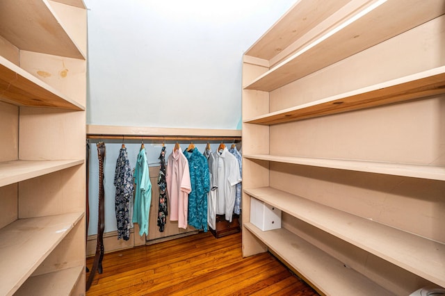 spacious closet featuring hardwood / wood-style floors