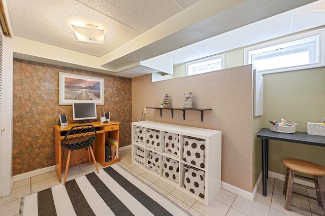 home office featuring tile patterned flooring and baseboards