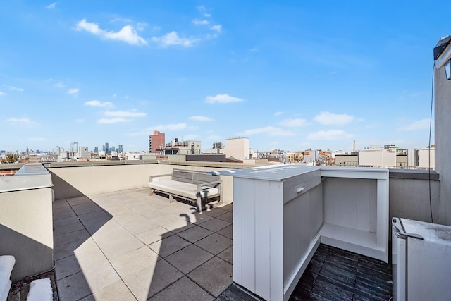 view of patio / terrace featuring a city view