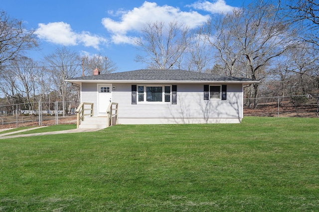 view of front of home featuring a front yard, fence, and a chimney