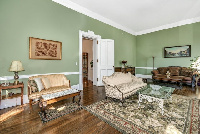 living room with ornamental molding, dark wood finished floors, and baseboards