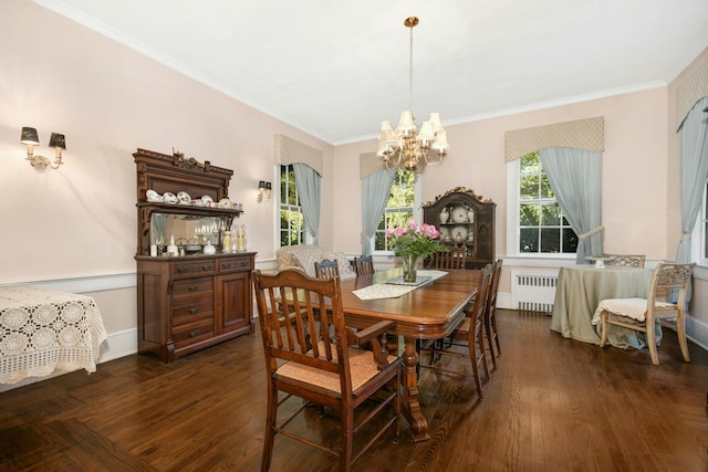 dining space featuring baseboards, radiator, dark wood-style flooring, crown molding, and a notable chandelier