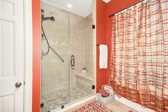 full bathroom featuring a stall shower and tile patterned floors