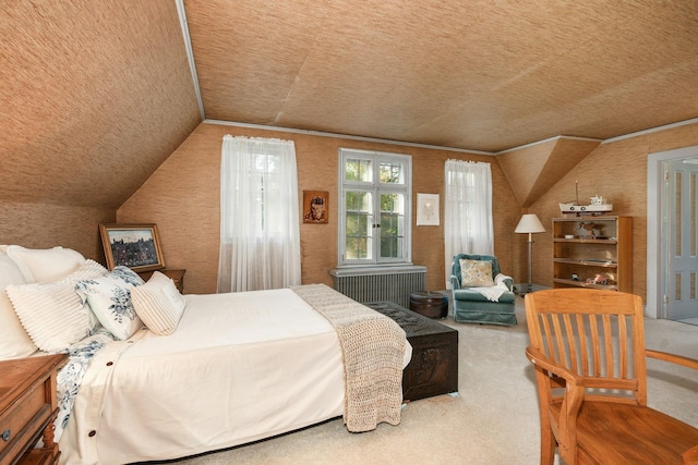 carpeted bedroom featuring radiator and vaulted ceiling