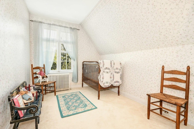 living area with radiator, wallpapered walls, carpet flooring, and lofted ceiling