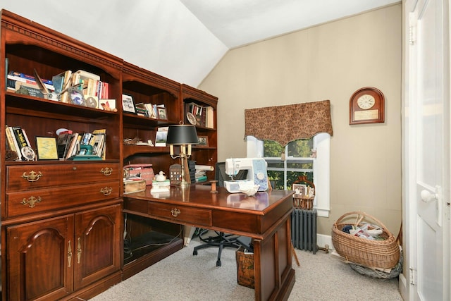 home office with lofted ceiling, radiator heating unit, and carpet floors