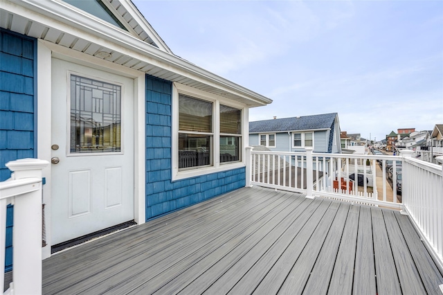 wooden deck featuring a residential view