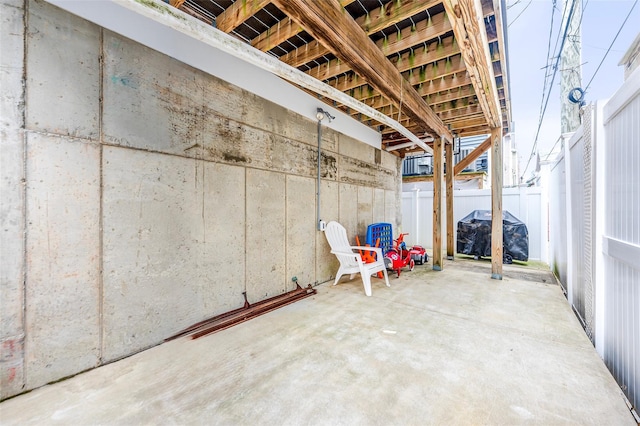 view of patio / terrace with a grill and fence