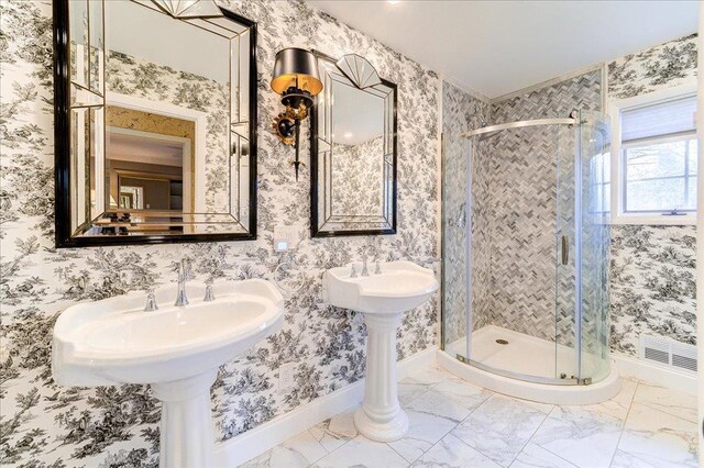 full bath with baseboards and a stall shower
