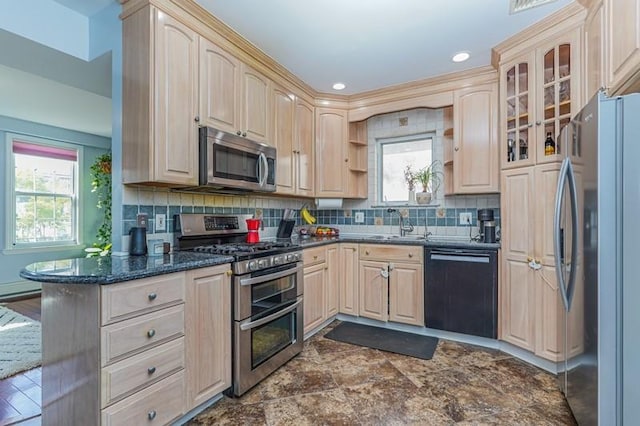 kitchen with light brown cabinets, glass insert cabinets, stainless steel appliances, and backsplash