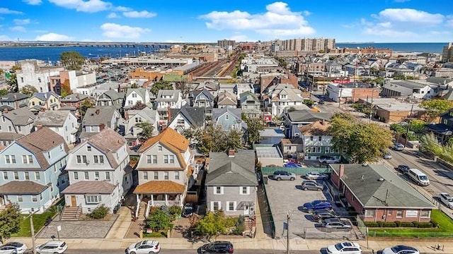 bird's eye view featuring a residential view and a water view