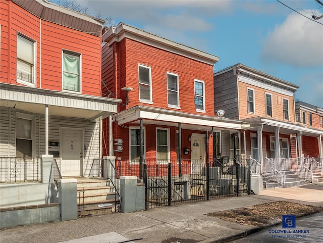 multi unit property featuring a porch