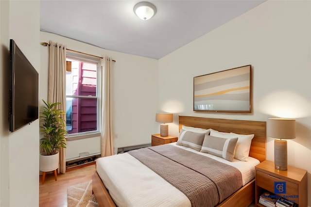 bedroom with wood finished floors