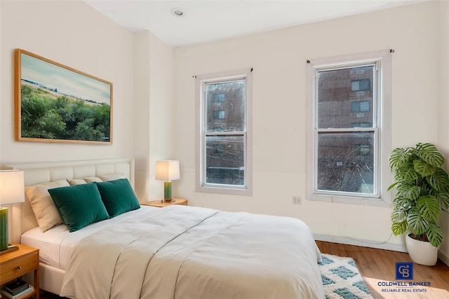 bedroom with wood finished floors