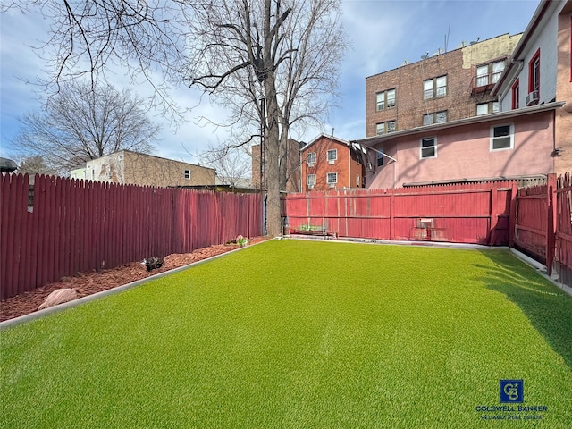 view of yard with a fenced backyard