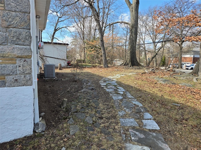 view of yard with central AC