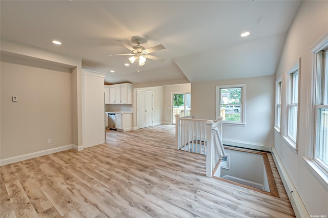 unfurnished living room featuring light wood finished floors, baseboards, and recessed lighting