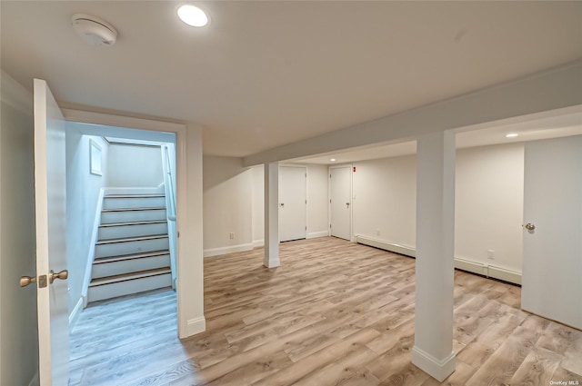 finished basement with baseboards, stairway, light wood-type flooring, and recessed lighting