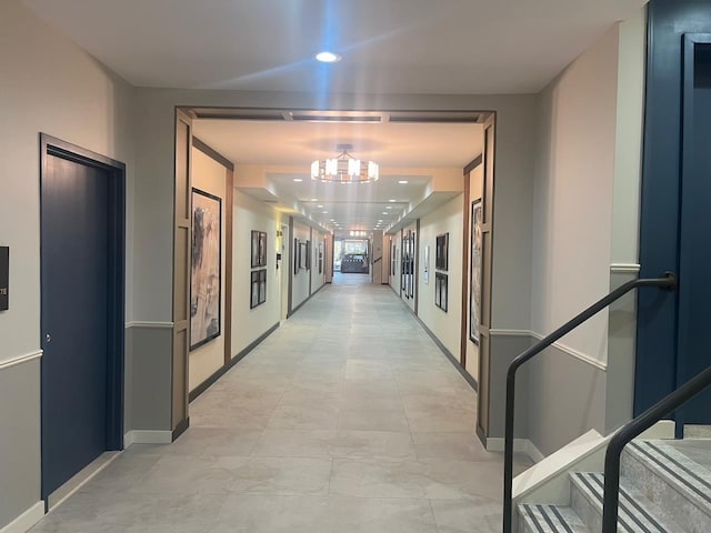 corridor featuring recessed lighting and baseboards