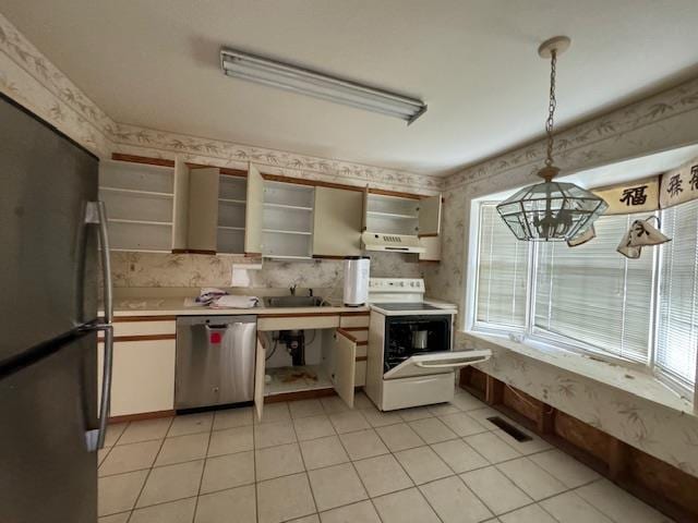 kitchen with electric range, dishwasher, freestanding refrigerator, under cabinet range hood, and open shelves