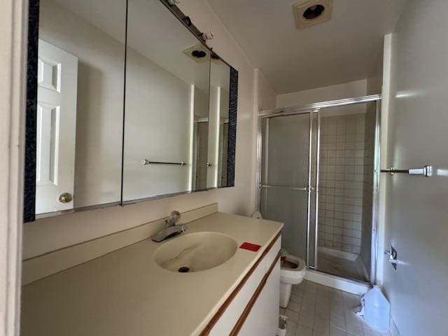 full bathroom with a shower stall, toilet, and vanity