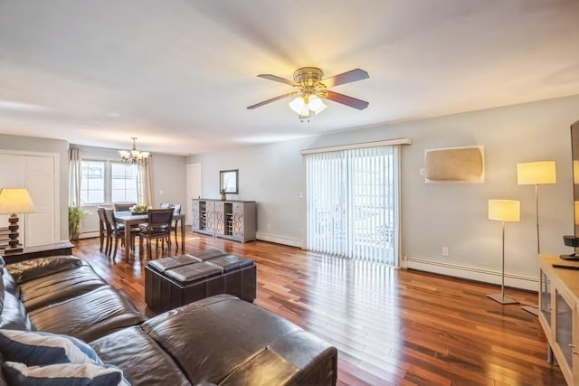 living room with wood finished floors, baseboards, and a baseboard radiator