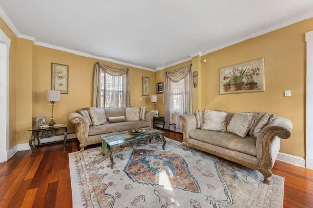 living room with ornamental molding, baseboards, and wood finished floors