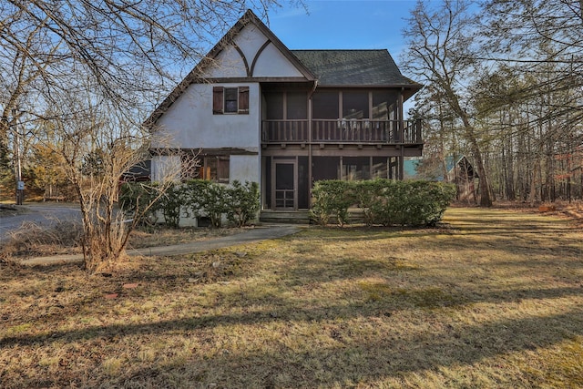 83 W Saugerties Rd, Saugerties, NY 12477 - view of front of house featuring a front lawn, roof with shingles, and a sunroom