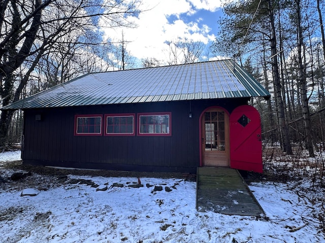 rustic home featuring metal roof