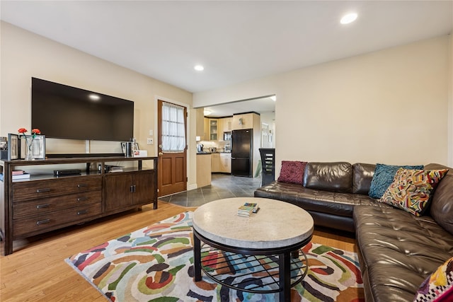 living room with recessed lighting and wood finished floors