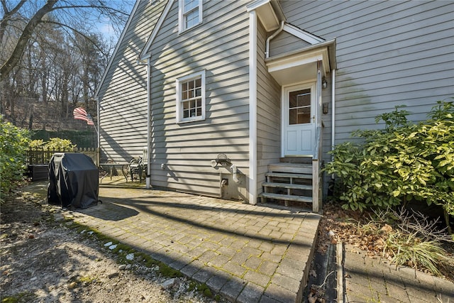 entrance to property featuring a patio area