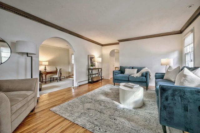 living area featuring arched walkways, a baseboard radiator, a baseboard heating unit, wood finished floors, and ornamental molding