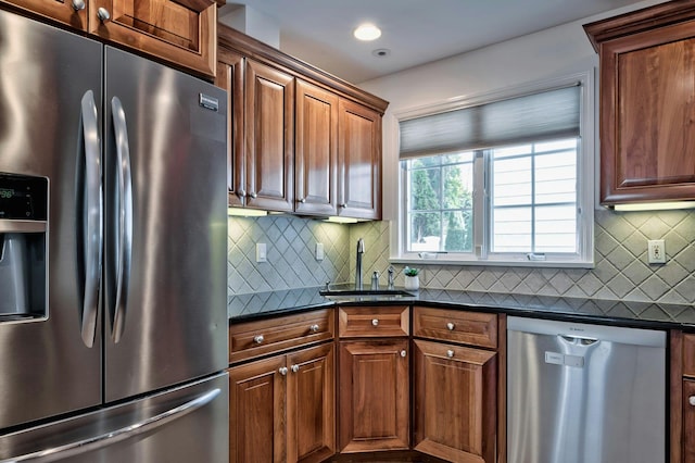 kitchen with stainless steel appliances, recessed lighting, a sink, and tasteful backsplash