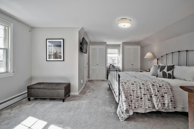 bedroom featuring baseboards, baseboard heating, and carpet flooring